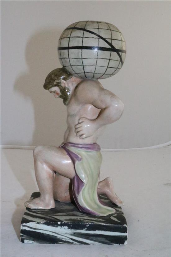 A Enoch Wood type pearlware figure of Atlas supporting a globe on his shoulder, c.1810, 24cm (9.5in.), restorations